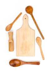 Kitchen wooden utensils flat lay over white background