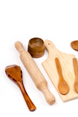 Kitchen wooden utensils set over white background