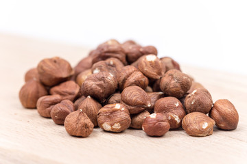 Bunch of hazelnut on the cutting board copy space