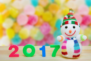 New year number 2017 and smiling snowman