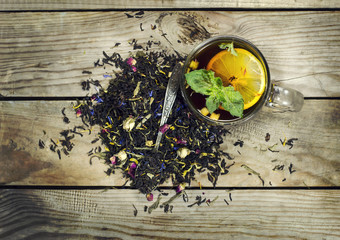 Cup of tea with lemon on a wooden background