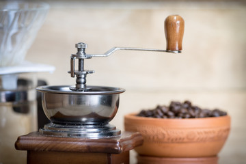 old vintage coffee grinder with coffee beans