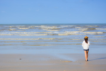 Women standing on the beach