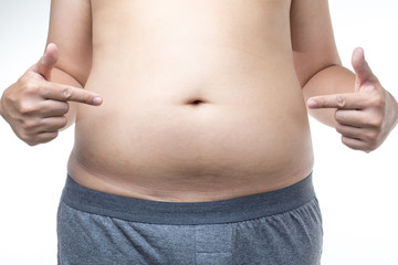 Fototapeta premium overweight man with hand pointing fat belly