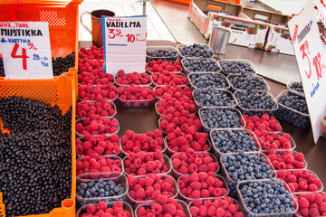    At the town market to sell strawberries and raspberries, blueberries and cherries.