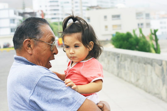 Latin grandfather with granddaughter