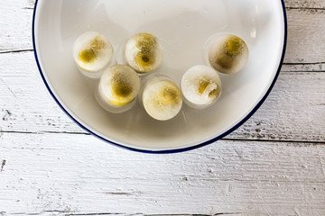 olives stuffed inside an ice cube