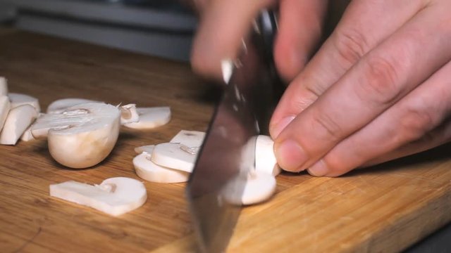 Knife Cut Mushrooms Cooking - cutting mushrooms in the kitchen.