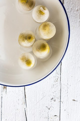 olives stuffed inside an ice cube