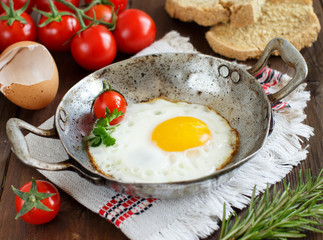 Fried egg on an old frying pan