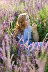 girl in a field of purple salvia 