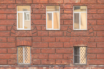 Fototapeta na wymiar Several windows in a row on facade of St. Petersburg University of the Russian Interior Ministry front view.