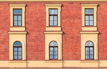 Fototapeta na wymiar Several windows in a row on facade of urban office building front view, St. Petersburg, Russia.