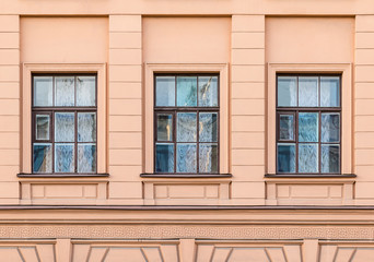 Several windows in a row on facade of urban office building front view, St. Petersburg, Russia.