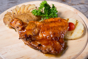 Fired chicken with baked potato and pineapple