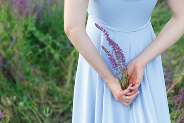 girl holding salvia bouquet