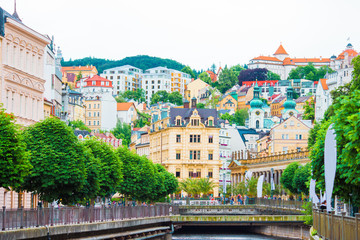 Colorful hotels and traditional buildings on sunny town of Karlovy Vary. The most visited spa town...