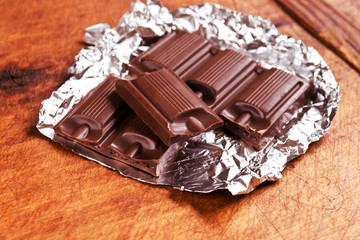 Chocolate bar on wooden table