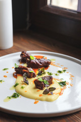 Steamed in white wine beef with potato cream and thick gravy