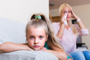 Woman and little daughter having quarrel