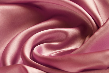 Obraz premium large folds on the pink fabric, abstract background