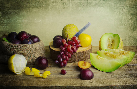 Still Life with delicious fruits were placed together on a wooden table beautifully