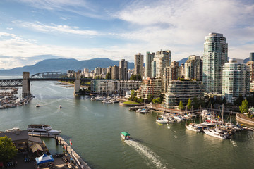 View of Downtown Vancouver and Burrard Bridge at False Creek during sunny evening