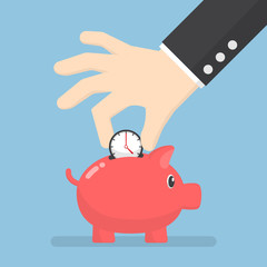 Businessman hand putting clock into piggy bank