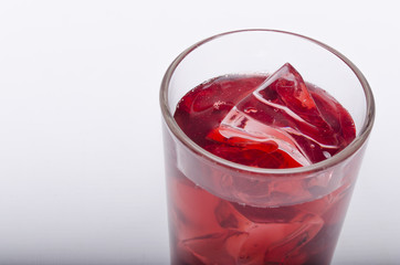 cherry juice with ice on a white background
