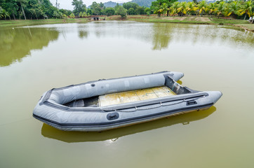 Blue inflatable boat on the water