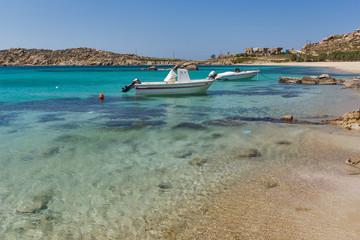Fototapeta na wymiar Clean Waters of Paranga Beach on the island of Mykonos, Cyclades, Greece