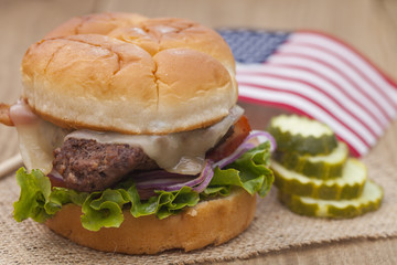 American grilled hamburger with USA flag. 4th of July. Independence day.
