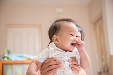 Little baby boy 7 months with thumb finger in the mouth