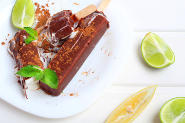 ice cream chocolate popsicle fruit white wooden background
