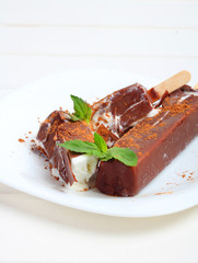 ice cream chocolate popsicle fruit white wooden background
