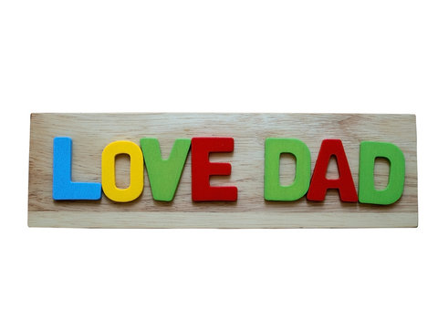 Love dad. Happy Father's Day celebrations. Love dad word from colorful of wood on wooden background isolate on white background. Father's day.