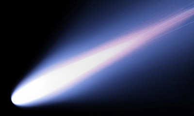 A bright comet with large dust and gas trails as the comets orbit brings it close to the Sun. © pentortorpong