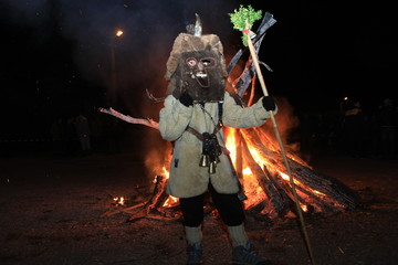 Pernik, Bulgaria - January 14, 2008: Unidentified man in traditional Kukeri costume are seen at the...