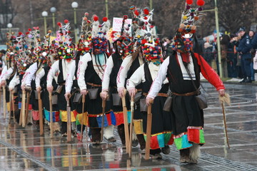 Pernik, Bulgaria - January 14, 2008: Unidentified man in traditional Kukeri costume are seen at the...