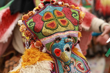 Pernik, Bulgaria - January 14, 2008: Unidentified man in traditional Kukeri costume are seen at the...