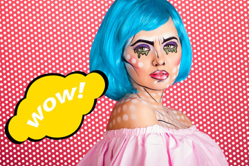 Photo of young woman with speech bubble and professional comic pop art make up. Creative beauty style.