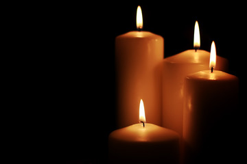 Fototapeta na wymiar candle light isolated black