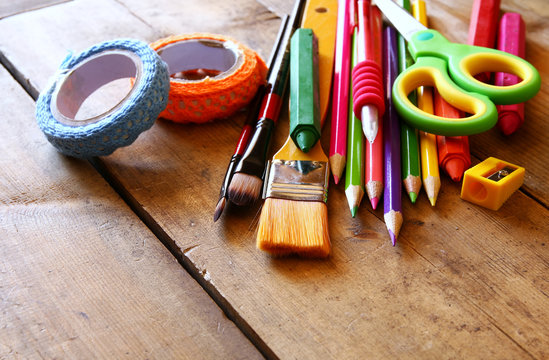 Back to school concept. School supplies on wooden desk