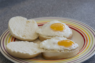 Two fried eggs in bread rolls