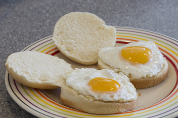 Two fried eggs in bread rolls