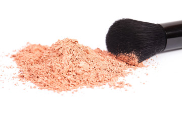 Powder blush and black makeup brush