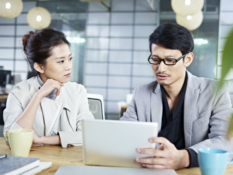asian business people working together in office