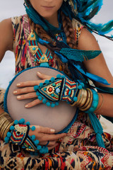 attractive young woman in ethnic jewelry close up portrait