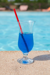 blue cocktail near pool