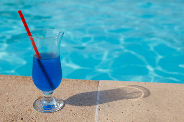 blue cocktail near pool
